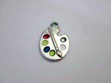 Load image into Gallery viewer, close up of Artist palette pendant necklace on black cord, with painted paint sports, for unisex teen or adult. (photo taken on a white background)