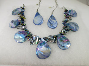 front view of rainbow blue seashell and pearl necklace and earrings set