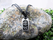 Load image into Gallery viewer, Kanji symbol for Confidence pendant with black background, black cord necklace style.