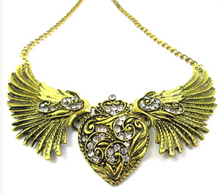 Load image into Gallery viewer, Antique gold steampunk fairy wings heart necklace front view close-up.
