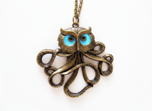 Load image into Gallery viewer, Bronze owl octopus pendant necklace glowing blue in the dark