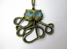 Load image into Gallery viewer, Glow in the dark owlctopus pendant necklace with blue eyes