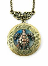Load image into Gallery viewer, Antique bronze sea turtle locket necklace with ocean scene, close-up