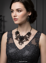 Load image into Gallery viewer, A woman wearing a black lace dress and a matching black rose filigree  statement necklace with matching drop earrings, shown in a dark gray indoor setting.  A small "AI-generated visual" label appears at the bottom.