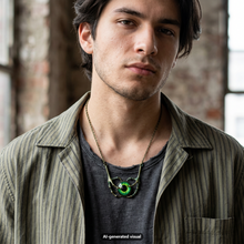 Load image into Gallery viewer, A man wearing a dragon claw necklace with green eye pendant on a chain, styled over a dark gray t-shirt and a striped olive-green shirt jacket, set against a blurred brick interior background.  A small "AI-generated visual" label appears at the bottom.