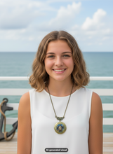 Load image into Gallery viewer, A smiling young woman with shoulder-length wavy brown hair stands outdoors by the ocean, wearing a white sleeveless top and a antique bronze sea turtle locket necklace with ocean scene.  A small "AI-generated visual" label appears at the bottom.