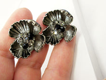Load image into Gallery viewer, metal flower sculpture earrings closeup