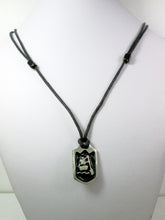 Load image into Gallery viewer, far front view of handmade pewter paddler pendant necklace, pendant with black background, on black cord, for men or women