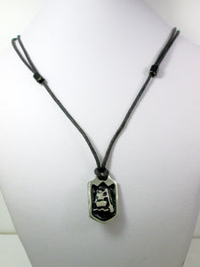 far front view of handmade pewter paddler pendant necklace, pendant with black background, on black cord, for men or women