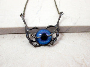 vintage style dragon claws holding eye necklace