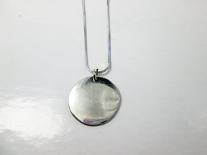 back view of mama pendant, showing pendant polished to mirror finish.