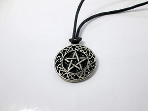 Celtic pentacle pendant necklace, round pendant with black background, on black cord, for unisex teen or adult. (photo taken on a white background)