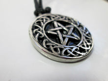 Load image into Gallery viewer, close up side view of Celtic pentacle pendant necklace, round pendant with black background, on black cord, for unisex teen or adult. (photo taken on a white background)