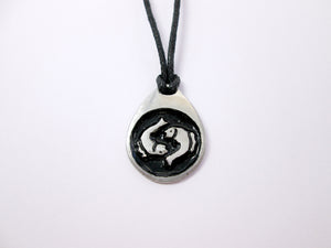Pisces pendant necklace on black cord, teardrop pendant with black background, for man or woman. (picture taken on a white background)