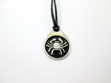 Load image into Gallery viewer, Cancer pendant necklace on black cord, teardrop pendant with black background, for man or woman. (picture taken on a white background)