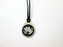 Load image into Gallery viewer, Taurus pendant necklace on black cord, teardrop pendant with black background, for man or woman. (picture taken on a white background)