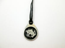 Load image into Gallery viewer, Taurus horoscope pendant necklace on black cord, teardrop pendant with black background, for man or woman. (picture taken on a white background) 
