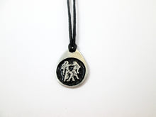 Load image into Gallery viewer, Gemini horoscope pendant necklace on black cord, teardrop pendant with black background, for man or woman (picture taken on a white background)