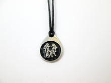 Load image into Gallery viewer, Gemini pendant necklace on black cord, teardrop pendant with black background, for man or woman. (picture taken on a white background)