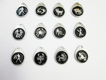 Load image into Gallery viewer, display of twelve horoscope signs teardrop pendants with black background.  Top row from left to right: Aquarius, Pisces, Aries, Taurus.  Middle row from left to right: Gemini,  Cancer, Leo, Virgo.  Bottom row from left to right: Libra, Scorpio, Sagittarius, Capricorn.  (picture taken on a white background)    