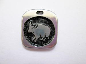 Year of the ox Chinese zodiac pendant with black background. (picture taken on a white background)