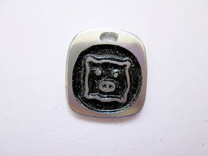 Year of the pig pendant with black background. (picture taken on a white background)