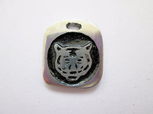 Year of the tiger pendant with black background. (picture taken on a white background)
