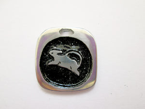 Year of the rat or mouse pendant with black background. (picture taken on a white background)