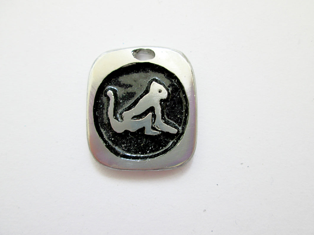 Year of the monkey Chinese zodiac pendant with black background (picture taken on a white background)