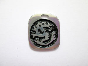 Year of the dragon pendant with black background. (picture taken on a white background)