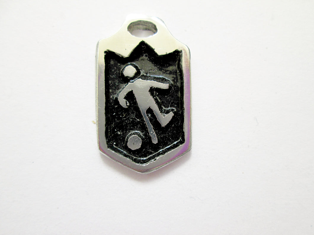 close up of handmade soccer player pendant with black background, for men or women.