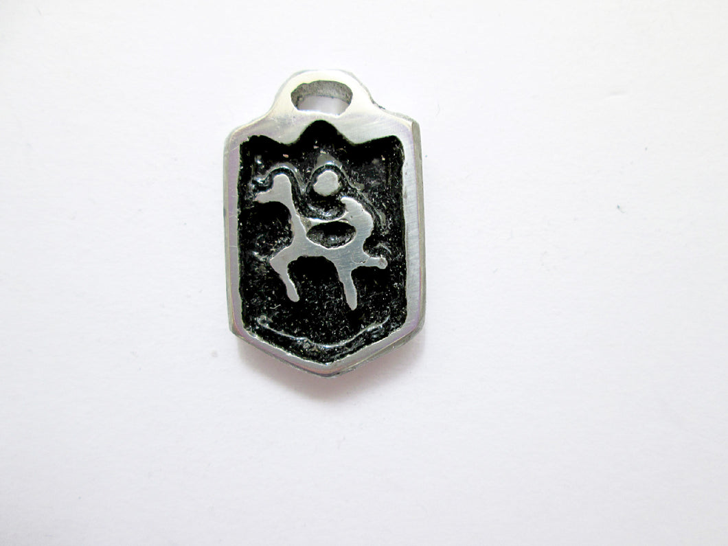 handmade pewter horse rider pendant with black background