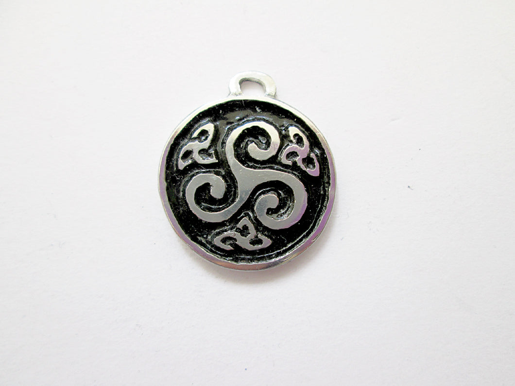 Celtic triskele pendant necklace, round pendant with black background, for unisex teen or adult. (photo taken on a white background)