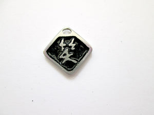 Chinese symbol of laugh pendant with black background.