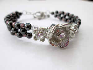 fancy silver flower magnetic bracelet with purple beads