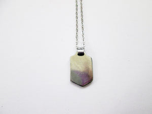 back view of runner pendant necklace, on metal chain, picture showing pendant polished to mirror finish.