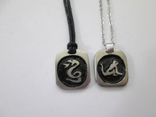 Load image into Gallery viewer, sample of year of snake necklace on black cord and year of monkey necklace on metal chain.