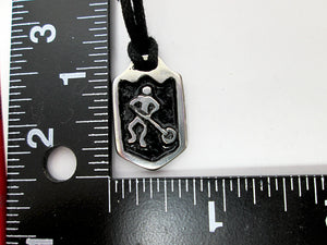 showing measurement of ringette player pendant 