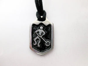 handmade pewter ringette player pendant necklace, pendant with black background, on black cord, for men or women.