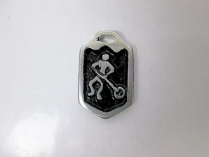 close up view of handmade pewter ringette player pendant with black background, for men or women.