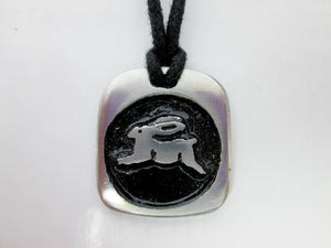 Year of the rabbit or bunny Chinese zodiac pendant necklace for unisex, squarish pendant with black background, cotton cord style. (picture taken on a white background) 