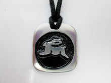 Load image into Gallery viewer, Year of the rabbit or bunny necklace, for unisex, squarish pendant with black background, cotton cord style. (picture taken on a white background)