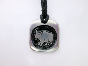 Year of the ox necklace, for unisex, squarish pendant with black background, cotton cord style. (picture taken on a white background)