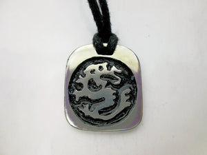 Year of the dragon necklace, for unisex, squarish pendant with black background, cotton cord style. (picture taken on a white background)