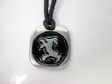 Load image into Gallery viewer, Year of the sheep or goat or ram, Chinese zodiac animal sign pendant necklace for unisex, squarish pendant with black background, cotton cord style. (picture taken on a background with a rock)