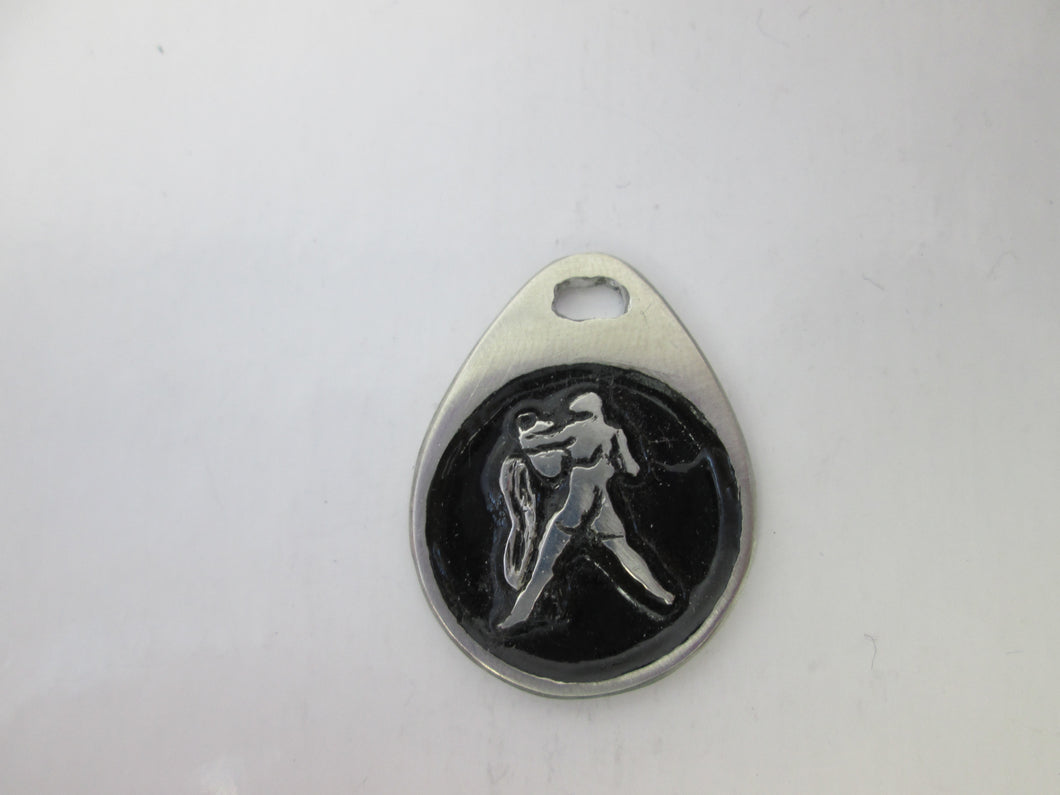 Aquarius horoscope pendant with black background, teardrop shaped, for man or woman. (photo taken on a white background.)