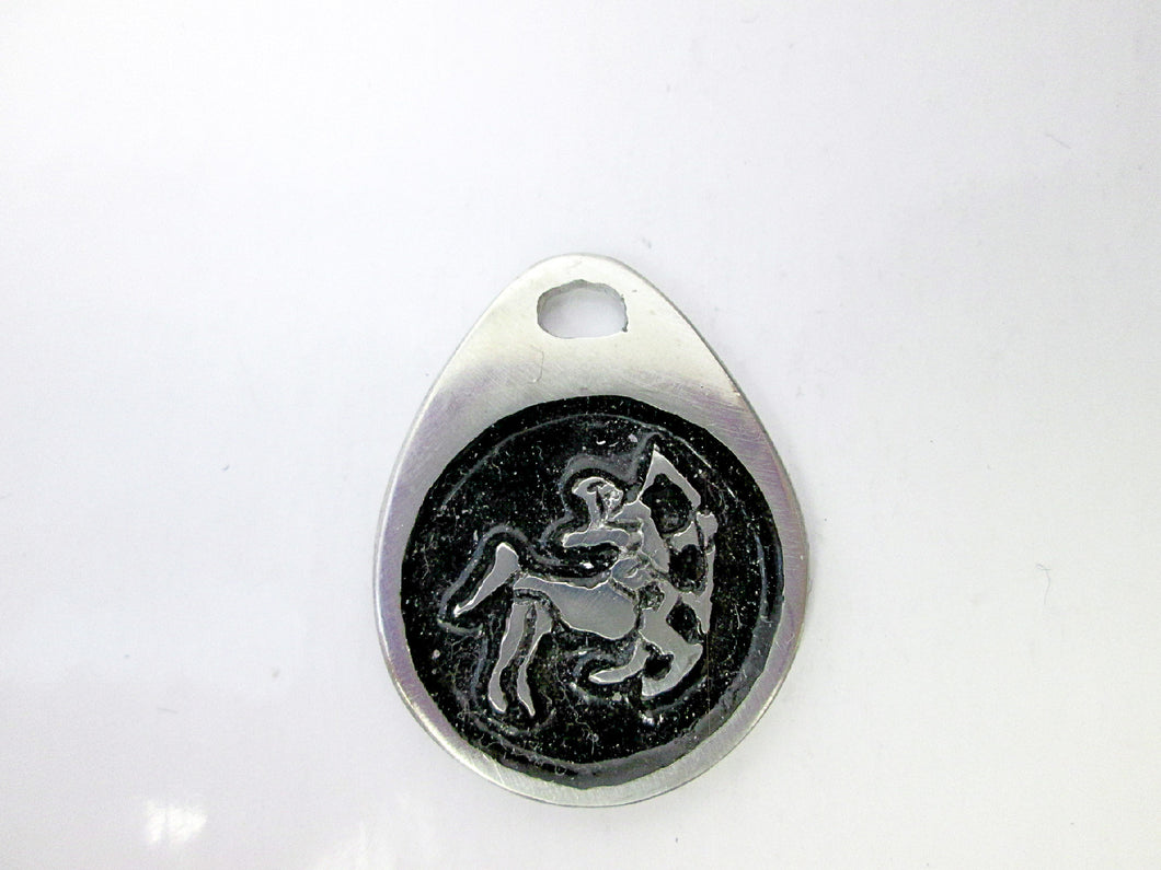 Sagittarius horoscope teardrop pendant with black background, for man or woman. (picture taken on a white background)