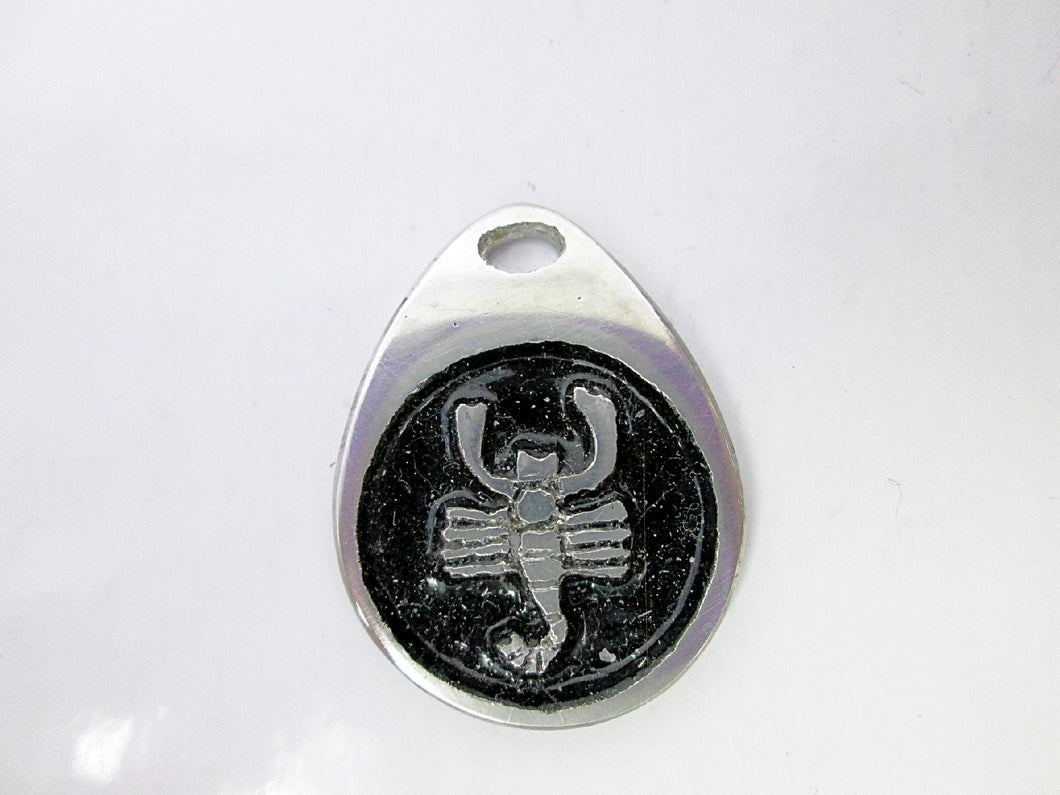 Scorpio horoscope teardrop pendant with black background, for man or woman (photo taken on a white background)