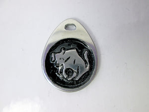 Taurus horoscope teardrop pendant with black background, for man or woman. (picture taken on a white background)