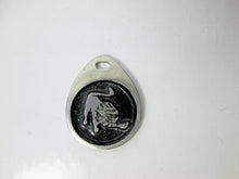 Load image into Gallery viewer, Leo horoscope pendant with black background, teardrop shaped, for man or woman. (photo taken on a white background)